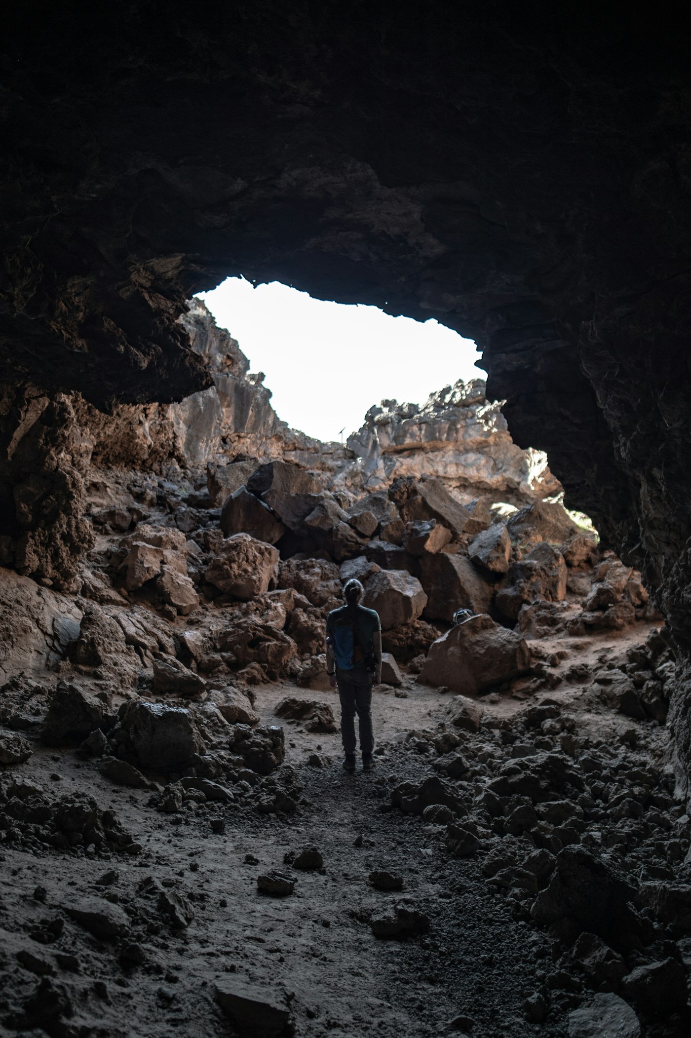 Illuminated walkway inside a volcanic lava tube